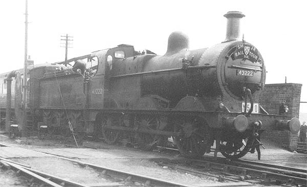 Ex-MR 0-6-0 3F No 43222 is seen standing at the head of an SMJ Rail Tour special as the fireman pulls coal forward