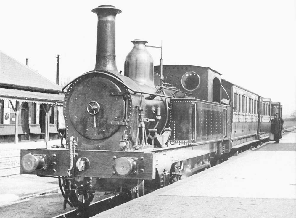 E&WJR 2-4-0T No 5 is standing in the station with a three coach service ready to depart for Broom Junction on 20th April 1897