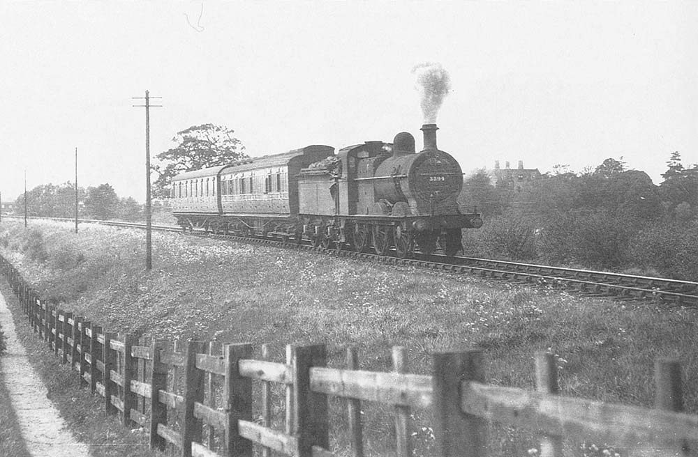 Ex-MR 3F 0-6-0 No 3884 proceeds towards Ettington with a two-coach local service on 15th May 1942
