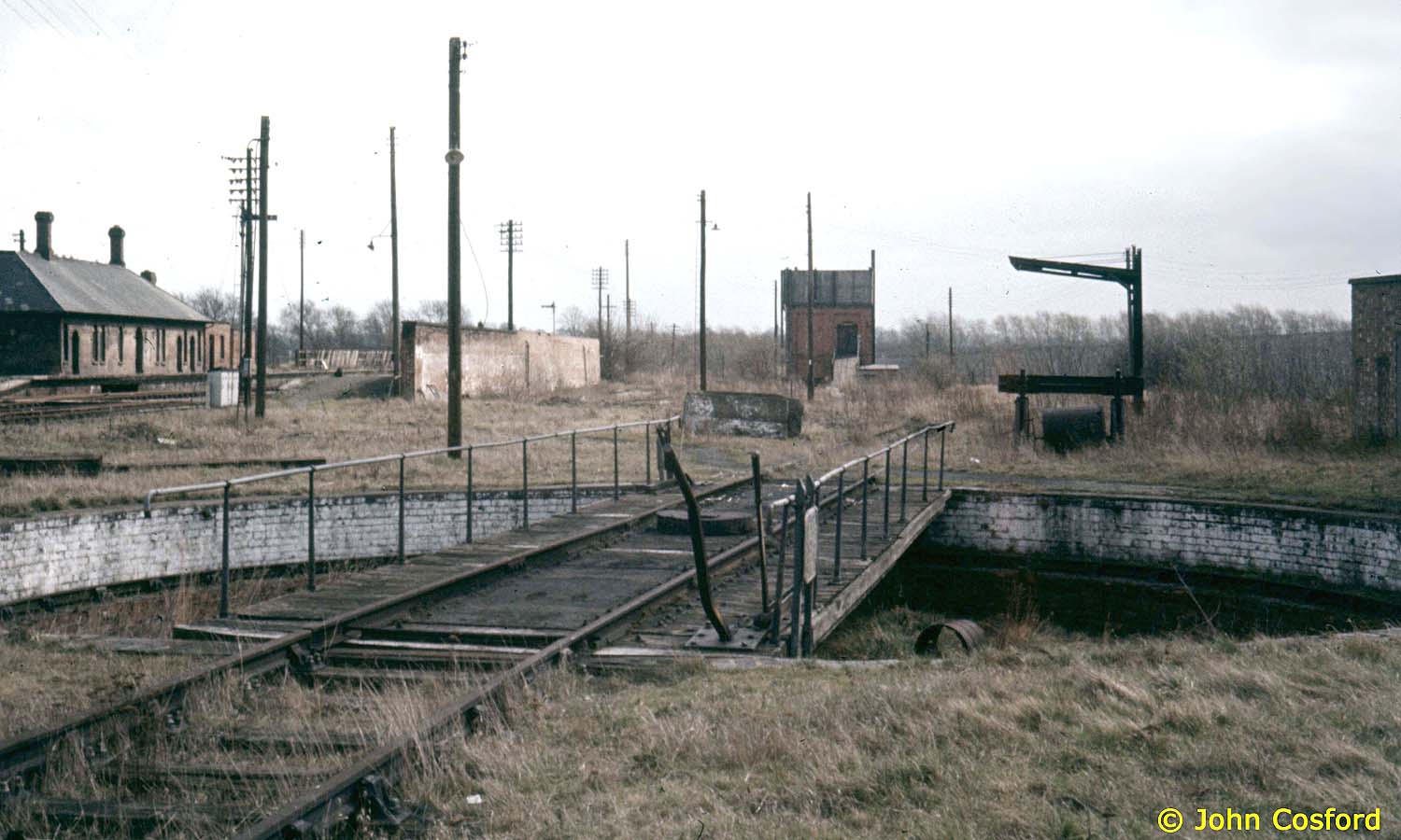 Looking across the long defunct turntable towards the now demolished engine shed with the coaling stage on the right