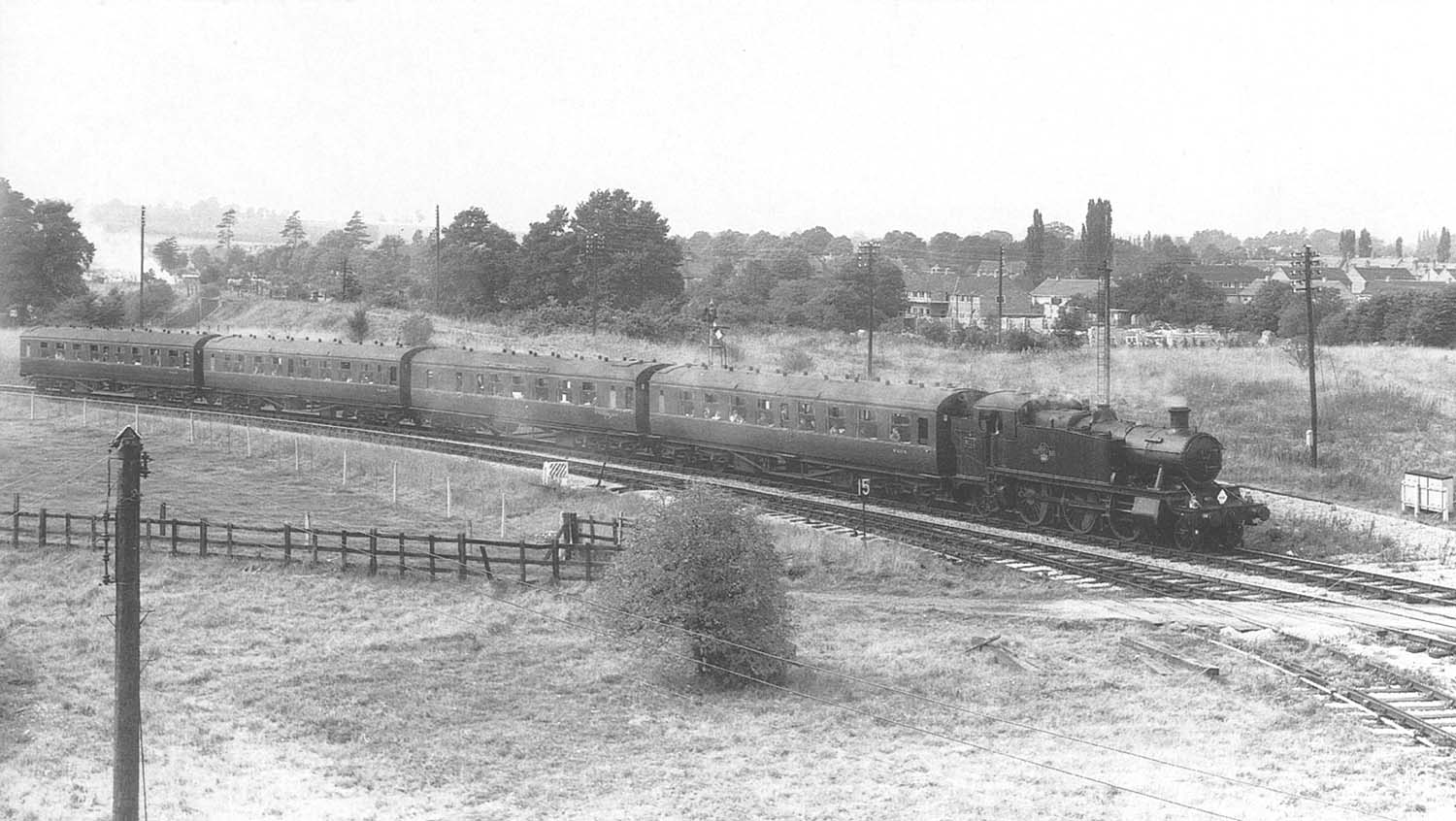 Ex-GWR 2-6-2T No 6111 on an Railway Enthusiasts Club special on the Stratford curve with four coaches heading east on 14th September 1963