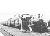 E&WJR 2-4-0T No 5 pauses with a eight-coach special train at the east end of the up platform to top up the tanks with water