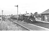 Ex-LMS 5MT 4-6-0 No 44919 enters the former SMJ station with the empty rolling stock of the royal train on 11th July 1964