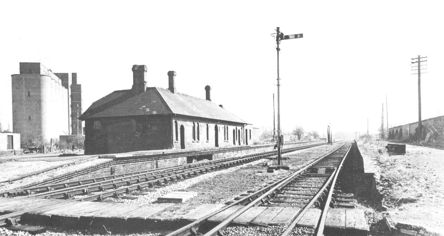 Two signals and a water crane watch over the bleak remains of Stratford Old Town station