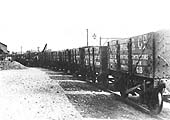 A line of Hutchings & Company's Private Owned six-plank open mineral wagons runs into the goods shed circa 1900