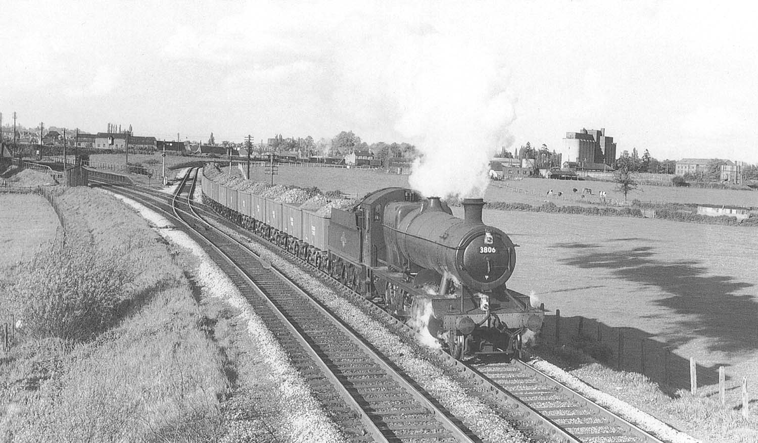 Ex-GWR 2-8-0 No 3806, with full wagons of iron ore, leaves the new south curve onto the line to Honeybourne on 25th April1961
