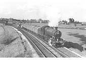 Ex-GWR 2-8-0 No 3806, with full wagons of iron ore, leaves the new south curve onto the line to Honeybourne on 25th April1961
