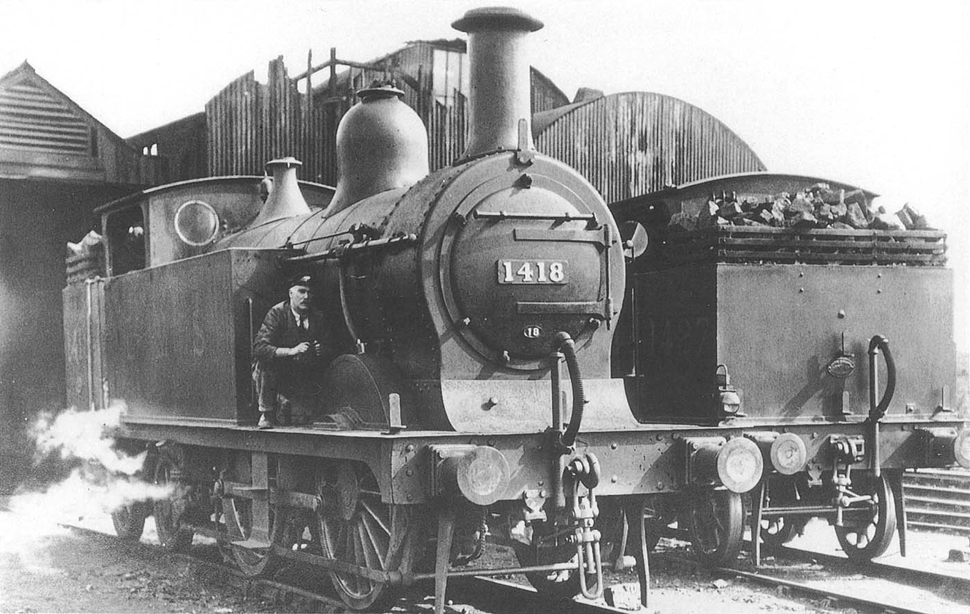 Ex-MR 0-4-4T No 1418 stands outside the original shed structure after the discontinuation of the Ro Railer service in 1932