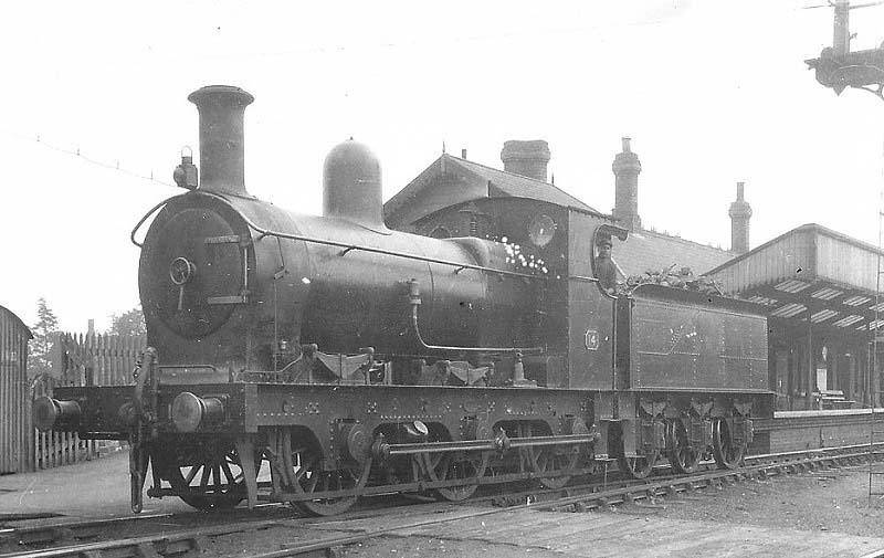 E&WJR 0-6-0 No 14 stands 'wrong road' on the up platform carrying Class 6 headlamps