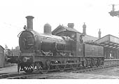 E&WJR 0-6-0 No 14 stands 'wrong road' on the up platform carrying Class 6 headlamps