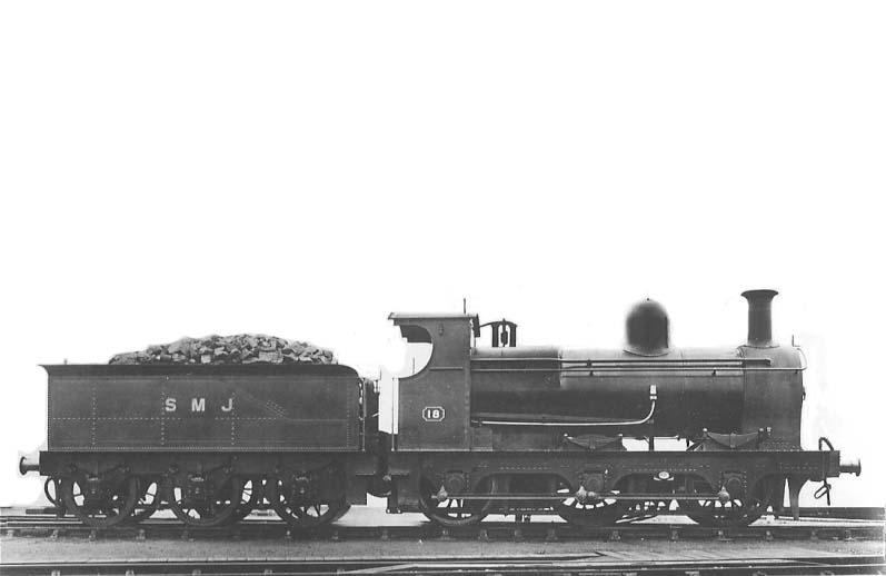 Ex-E&WJR 0-6-0 No 18 Frank Moore postcard, seen in its SMJ livery, poses for a 'Frank Moore' postcard photograph