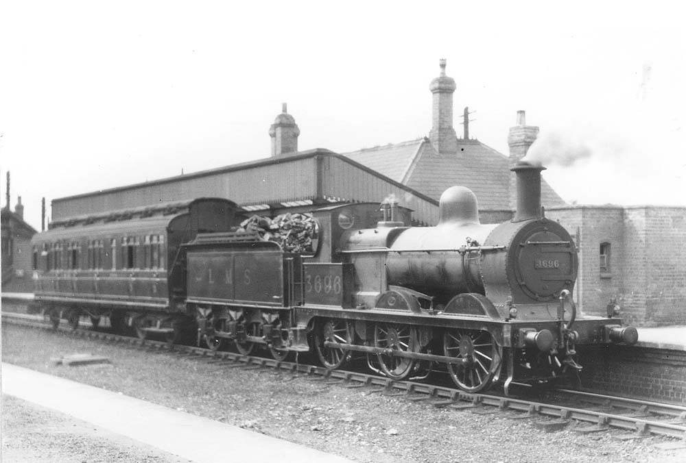 Ex-MR 2F 0-6-0 No 3696 stands at the up platform with single coach on a local passenger working to Towcester