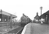 Ex-MR 3F 0-6-0 No 43693 is seen at the head of a local passenger train arriving from Towcesterin the 1950s