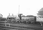 Ex-E&WJR 0-6-0 No 2300, formerly SMJ No 2, is seen in Stratford on Avon goods yard marshalling goods wagons