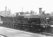 SMJ 0-6-0 No 18 is seen on 11th April 1924 heading a goods train through the station past the up platform