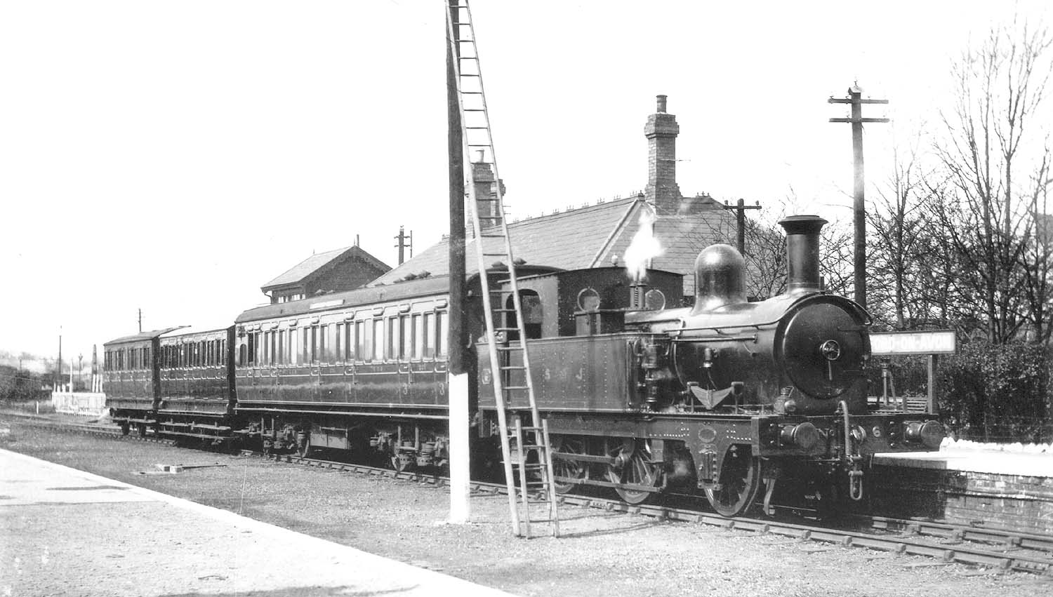E&WJR 2-4-0 No 6 standing the original station whilst at the head of three-coach passenger service for Towcester