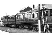 Close up showing the two rear coaches of the early period SMJ train