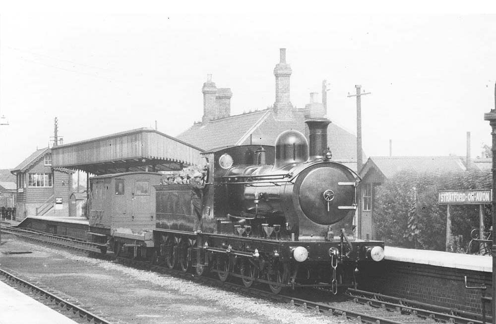 Ex-E&WJR 0-6-0 No 15, now in SMJ livery, stands immaculate in its livery with polished buffers at the head of a short goods train
