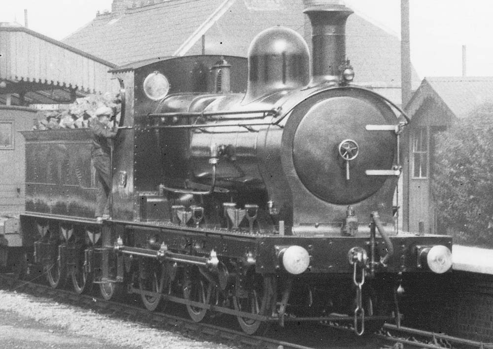 Close up showing ex-E&WJR 0-6-0 No 15 pausing for the driver to dismount at the up platform of Stratford on Avon station