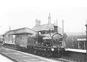 Ex-E&WJR 0-6-0 No 15, now in SMJ livery, stands immaculate in its livery with polished buffers at the head of a short goods train