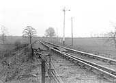 Looking along the single track route in the direction of Fenny Compton at a point just past Mill Bridge