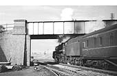 British Railways Standard Class 5 4-6-0 No 73032 is seen starting away from Charwelton with the south portal of Catesby tunnel just  visible in the distance