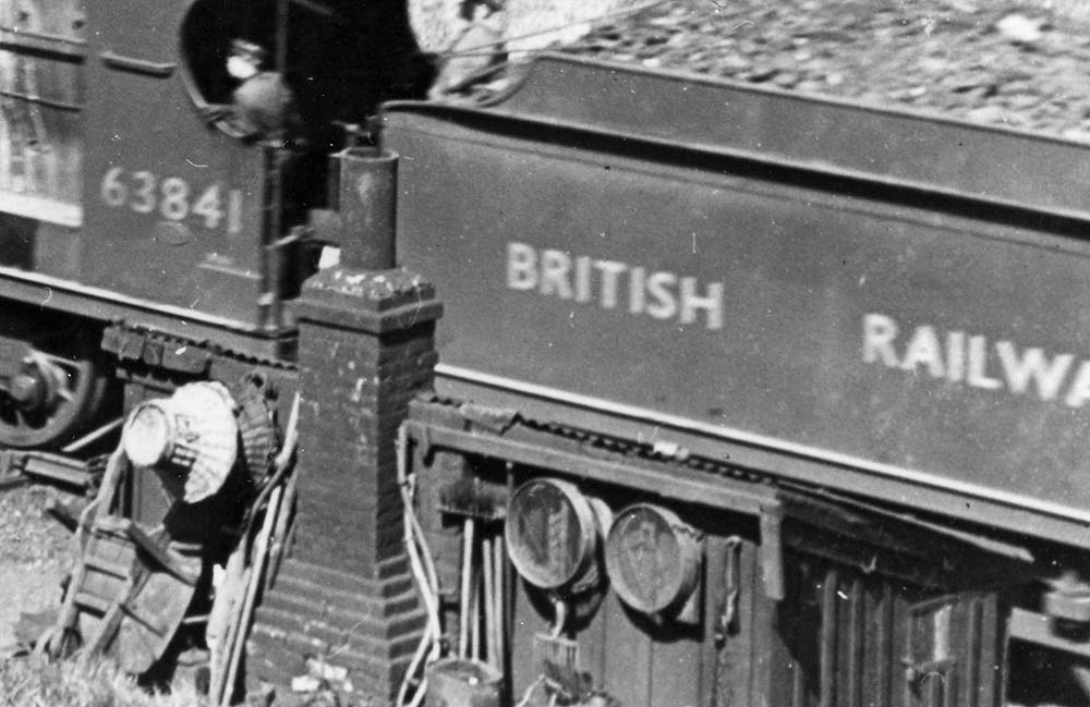 Close up showing hanging on the lineside hut the large variety of tools used by P&W gangs when maintaining the line