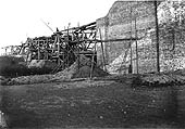 View of the completed brick abutment and the temporary scaffolding used on the bridge spanning the Oxford Canal