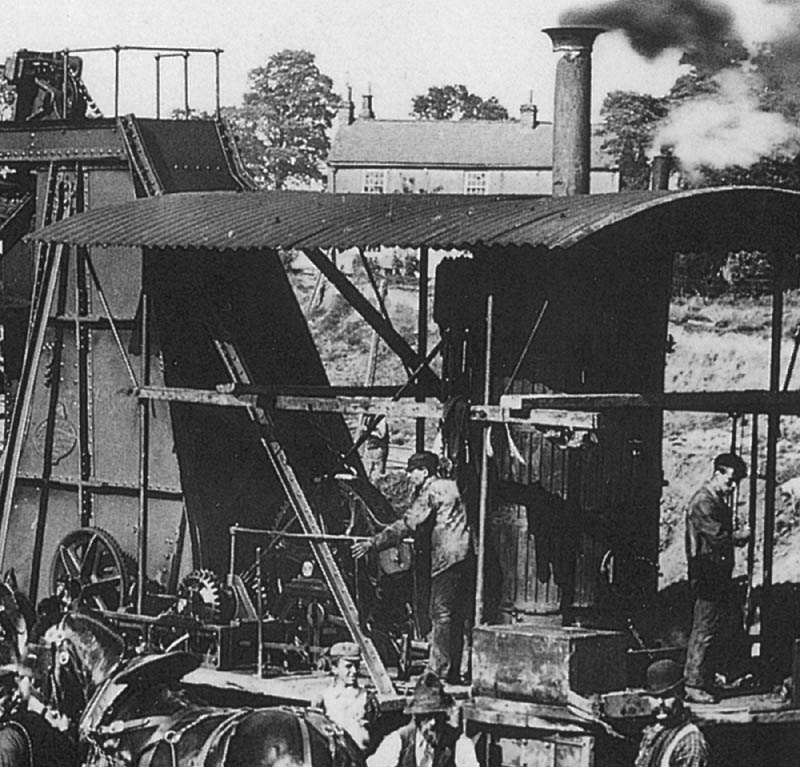 Close up of the driver of the steam navvy, its machinery and vertical boiler which operated the steam shovel
