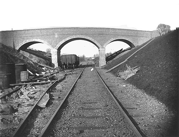 View along a section of temporary trackwork towards a completed brick arch overbridge south of Newton