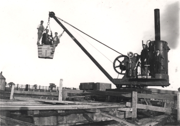 View of three labourers and a boy labourer preparing to descend down one of Catesby tunnel's shafts