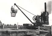View of three labourers and a boy labourer preparing to descend down one of Catesby tunnel's shafts