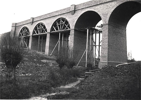 With the wooden centrings still to be removed Staverton Viaduct is seen in the final stages of its construction circa 1897
