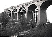 With the wooden centrings still to be removed Staverton Viaduct is seen in the final stages of its construction
