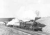 Ex-LNER 4-6-0 B1 61202 is seen passing beneath Catesby Road bridge on a York to Swansea express