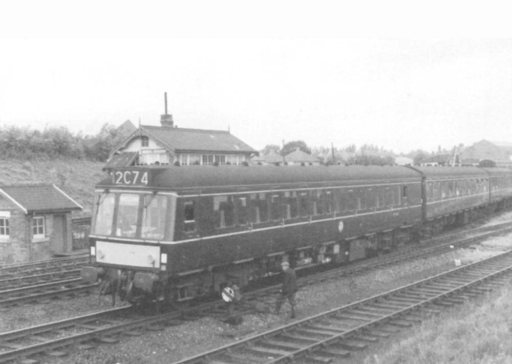 A British Railways Derby Diesel Multiple Unit is seen crossing over from the down line to the up line