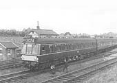 A British Railways Derby Diesel Multiple Unit is seen crossing over from the down line to the up line