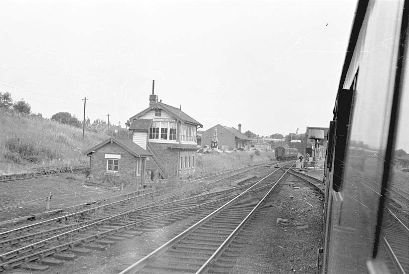 Looking towards Leicester with the overgrown entrance to Rugby Central's goods yard on the left of the signal cabin