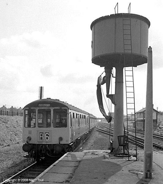 A Class 104 DMU set, having arrived from Nottingham, travels forward a short distance before reversing into the down platform