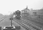 An unidentified British Railways English Electric Type 3 Diesel Electric locomotive is seen crossing the Birdcage bridge