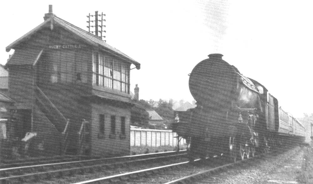 An unidentified ex-LNER V2 2-6-2 passes Rugby Cattle Sidings Signal Cabin on a Class A express service