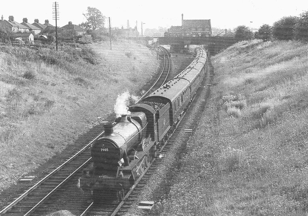 British Railways built 4-6-0 No 7905 'Fowey Hall' is seen passing through Rugby GC on a down express service