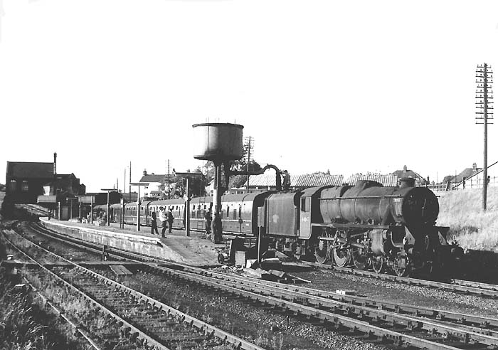 Ex-LMS 5MT 4-6-0 No 44847 is seen taking on water at Rugby Central station on 15th July 1966