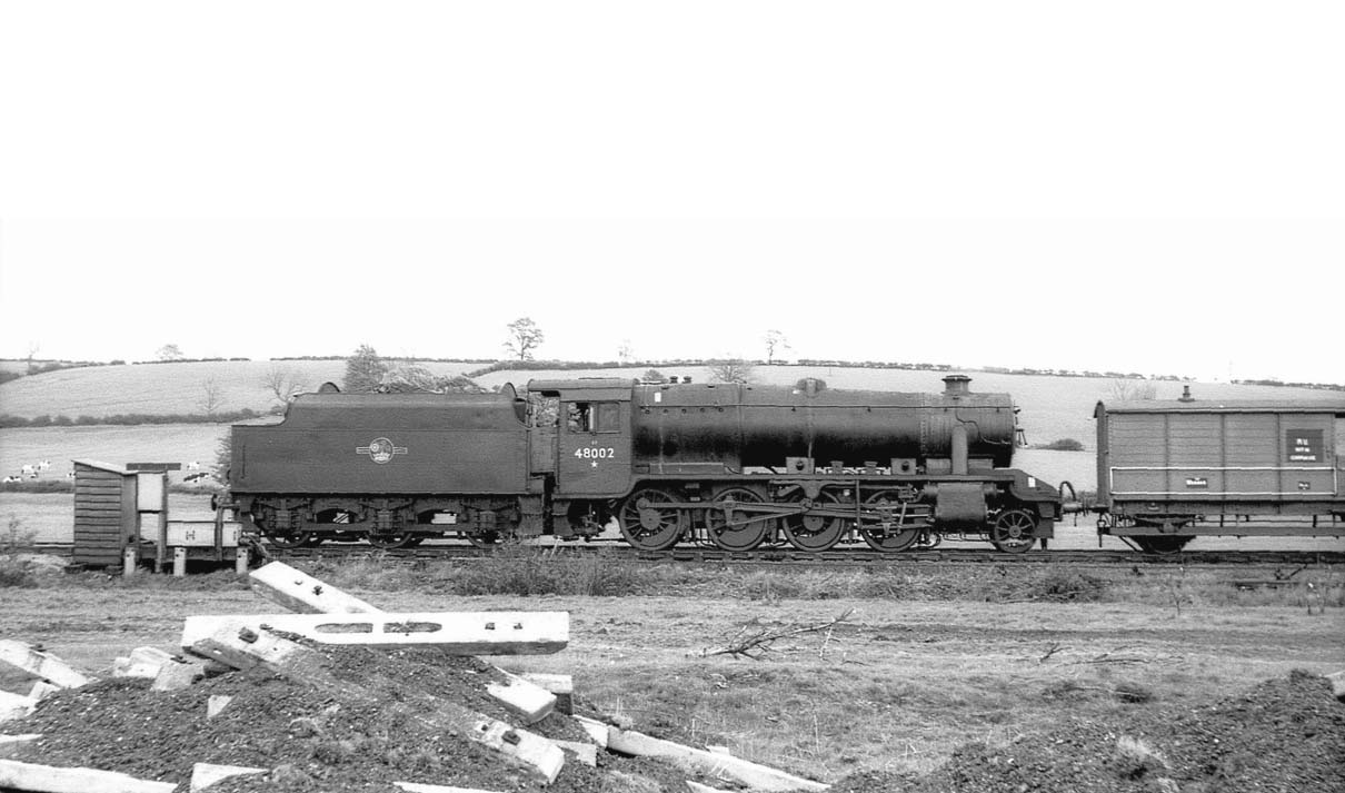 Ex-LMS 8F 2-8-0 No 48002 is seen assisting with major Permanent Way relaying work south of Rugby on Sunday 19th May 1963