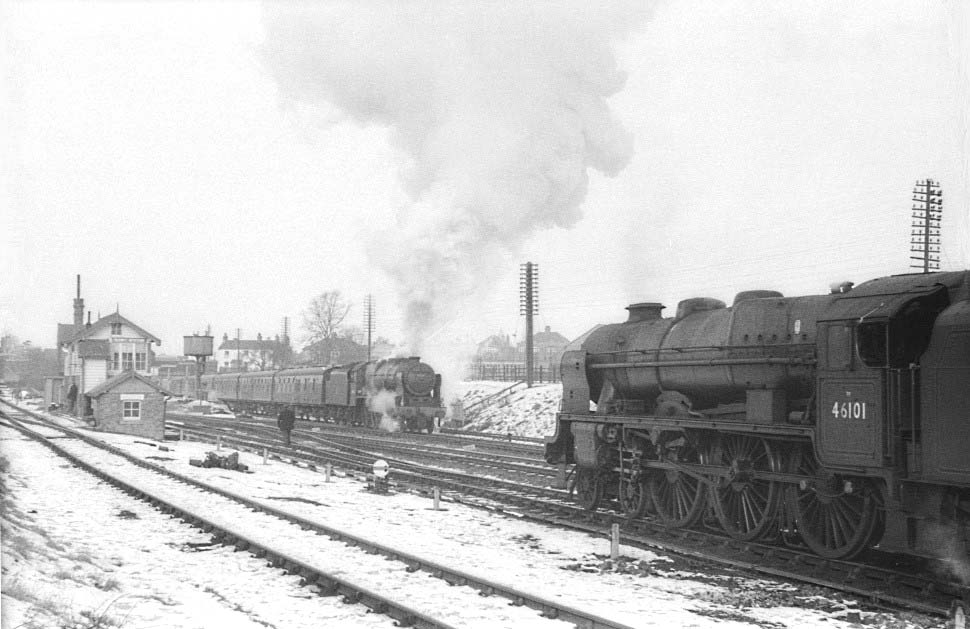 A pair of ex-LMS 4-6-0 Rebuilt Royal Scot locomotives, No 46101 'Royal Scots Grey' on the immediate right and No 46126 ' Royal Army Service Corps' in the distance, are seen on Friday 1st February 1963
