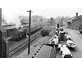 A grimy and unidentified ex-LMS 5MT 4-6-0 locomotive stands with the down local to Nottingham