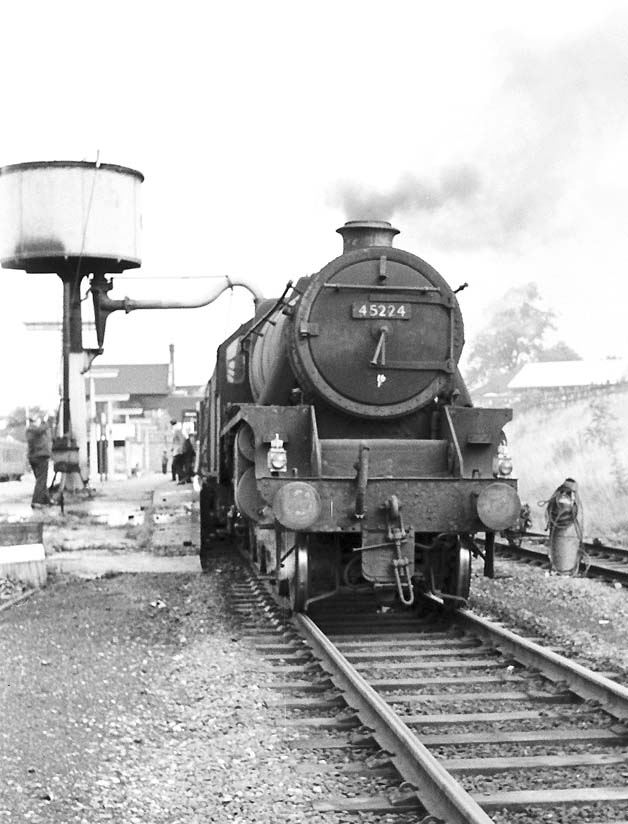 Ex-LMS 5MT 4-6-0 No 45224 stands at the head of an up express at Rugby Central's up platform whilst taking on water