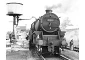 Ex-LMS 5MT 4-6-0 No 45224 stands at the head of an up express at Rugby Central's up platform whilst taking on water
