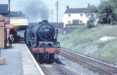 Ex-LMS 'Rebuilt Royal Scot' 4-6-0 No 46118 'Royal Welch Fusilier' stands at Rugby on an up express service in 1962