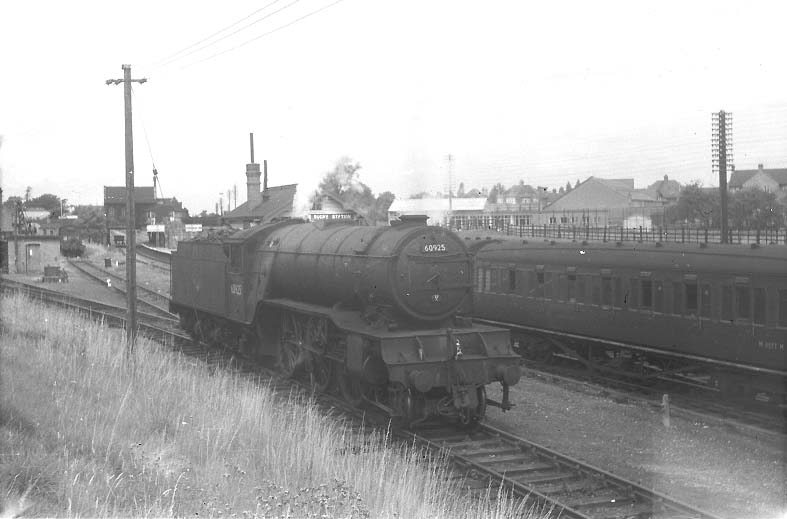 Ex-LNER V2 2-6-2 No 60925 is seen attaching a second brake van to the rear of a coal train on Thursday 3rd August 1961